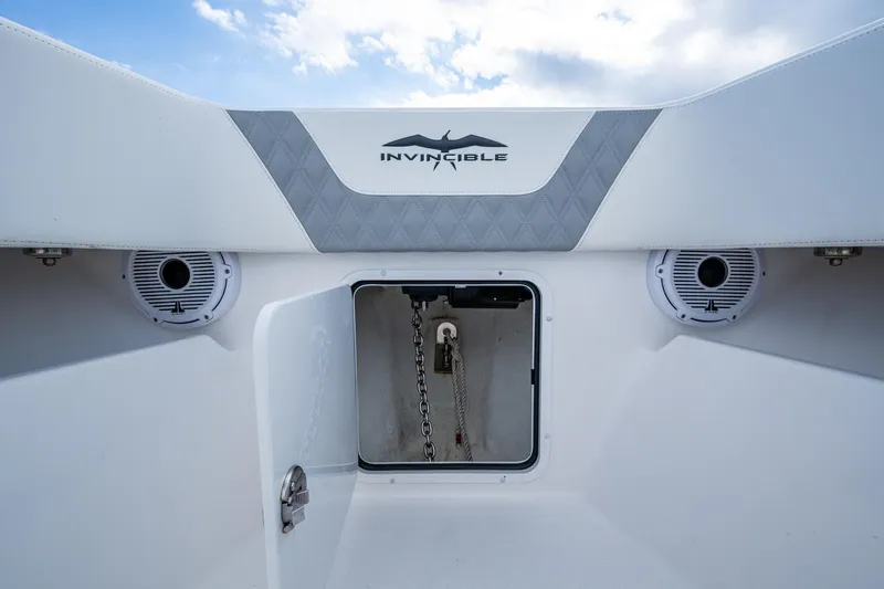  Yacht Photos Pics 2023 Invincible 36 Open Fisherman boat anchor compartment with speakers and logo.