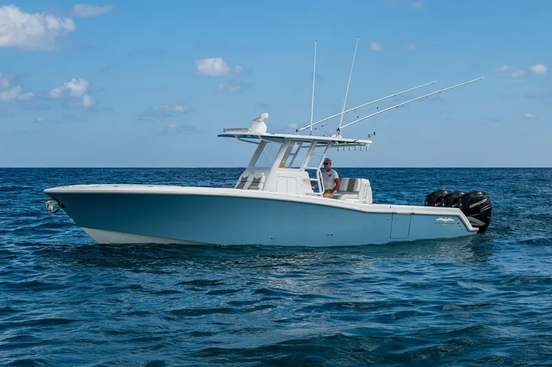  Yacht Photos Pics 2023 Invincible 36 Open Fisherman boat on open sea under blue sky.