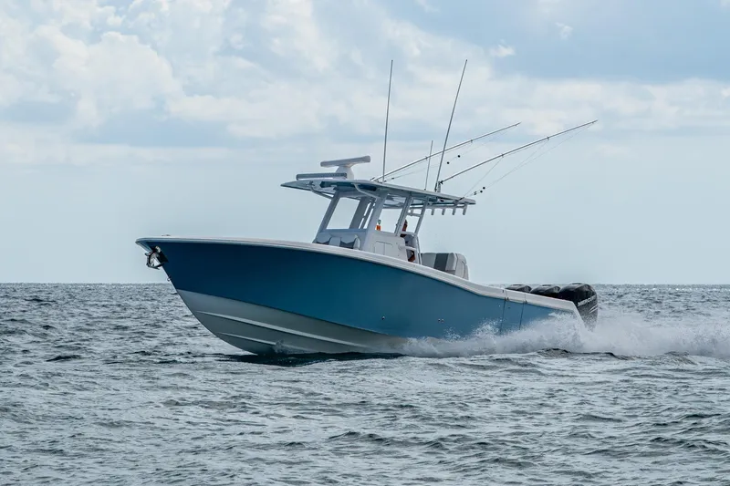  Yacht Photos Pics 2023 Invincible 36 Open Fisherman boat cruising on the ocean.