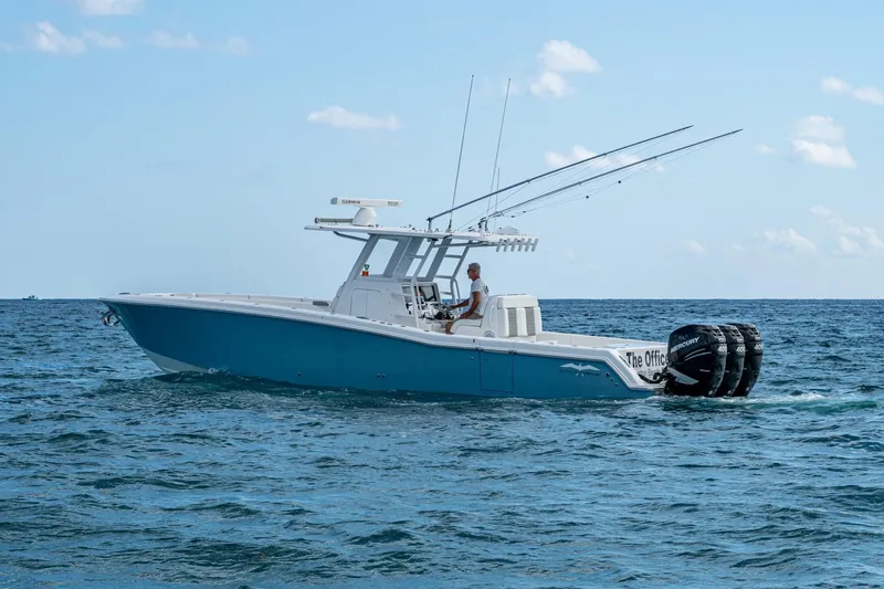  Yacht Photos Pics 2023 Invincible 36 Open Fisherman boat cruising on the ocean with multiple outboard engines.