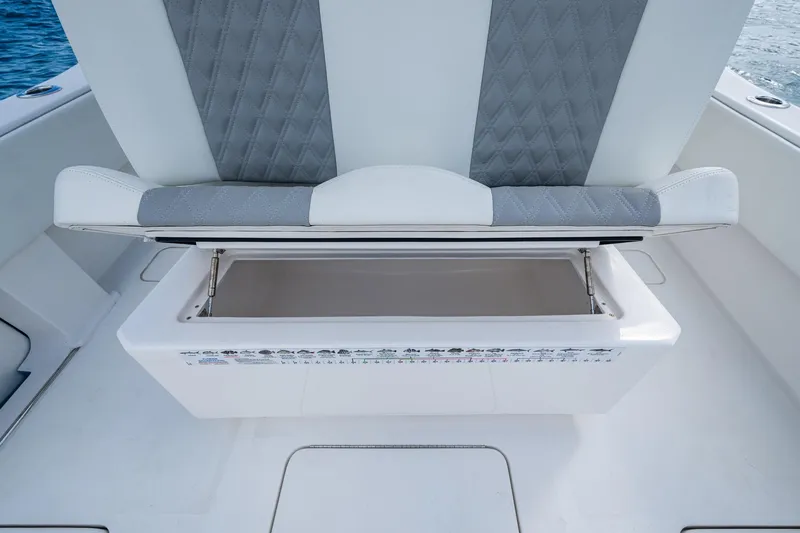  Yacht Photos Pics 2023 Invincible 36 Open Fisherman boat seat with storage compartment open.