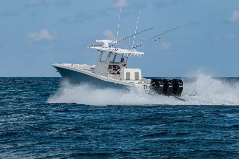  Yacht Photos Pics 2023 Invincible 36 Open Fisherman boat cruising on open water.