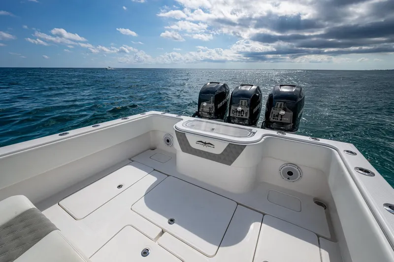  Yacht Photos Pics 2023 Invincible 36 Open Fisherman boat with triple engines on open sea.