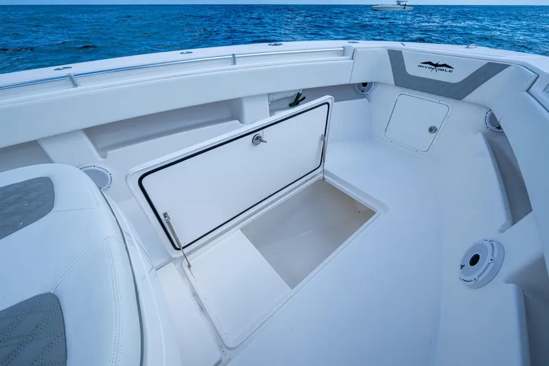  Yacht Photos Pics 2023 Invincible 36 Open Fisherman boat interior with storage compartment open.