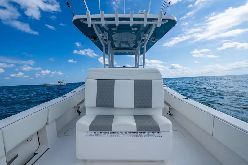  Yacht Photos Pics 2023 Invincible 36 Open Fisherman boat on open sea under blue sky.