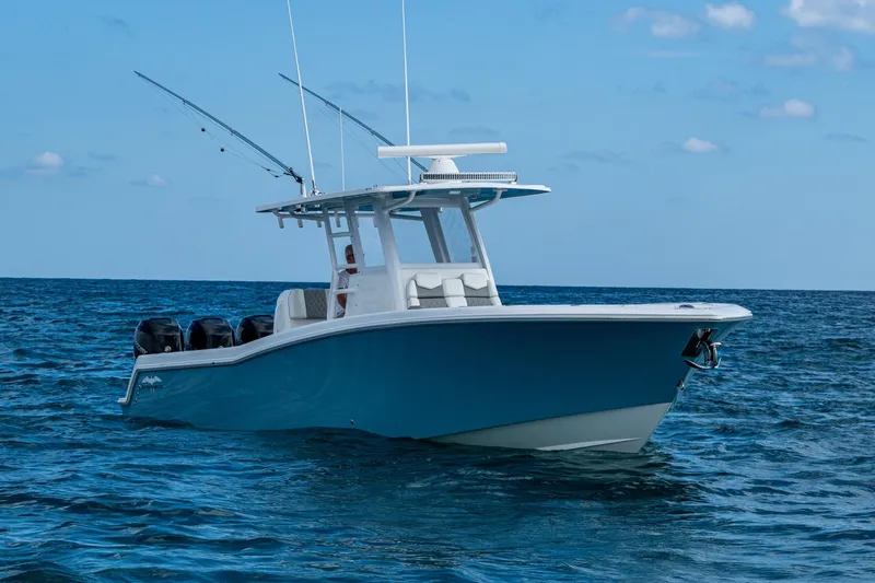  Yacht Photos Pics 2023 Invincible 36 Open Fisherman boat on open sea, clear sky background.