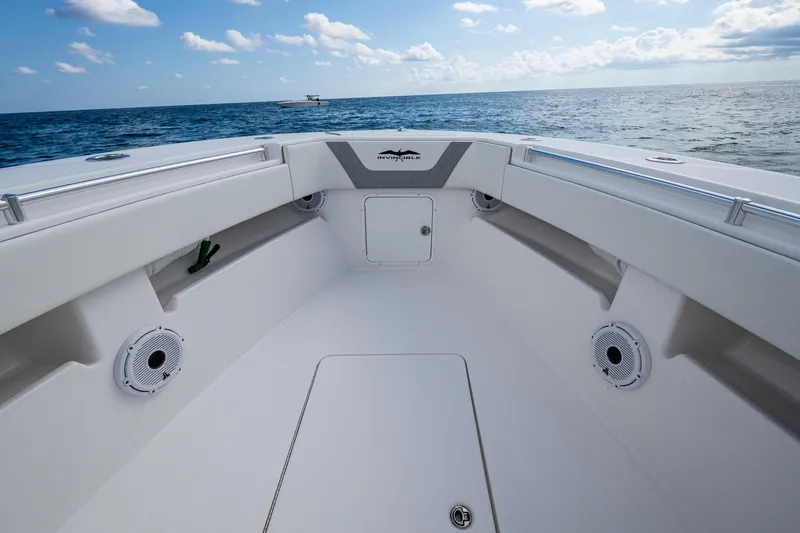  Yacht Photos Pics 2023 Invincible 36 Open Fisherman boat interior with ocean view, featuring sleek design and speakers.