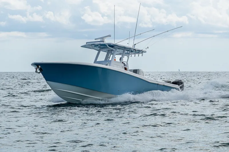  Yacht Photos Pics 2023 Invincible 36 Open Fisherman boat cruising on the ocean.