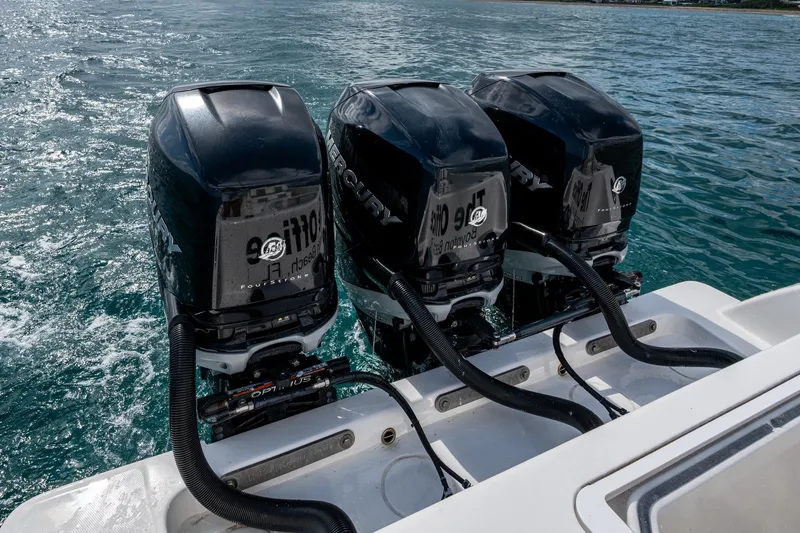  Yacht Photos Pics Triple Mercury outboard engines on 2023 Invincible 36 Open Fisherman boat in ocean.