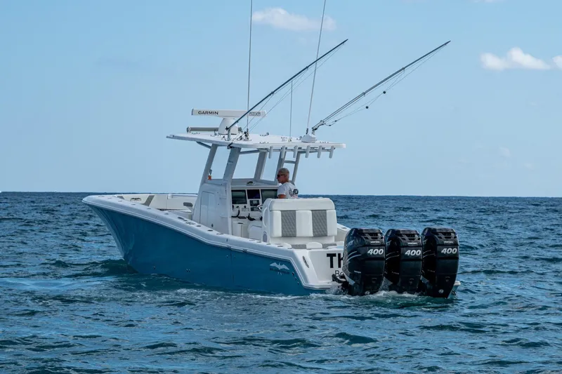  Yacht Photos Pics 2023 Invincible 36 Open Fisherman boat with triple 400 engines on the ocean.