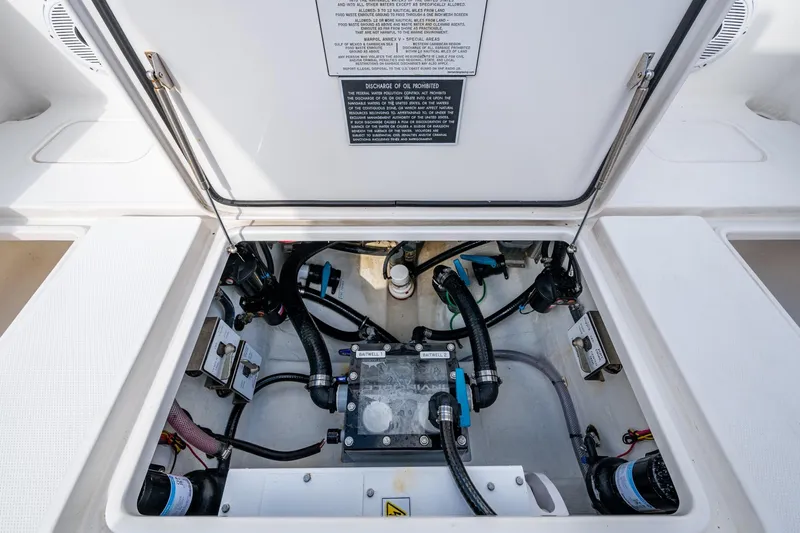  Yacht Photos Pics 2023 Invincible 36 Open Fisherman boat compartment with visible wiring and components.