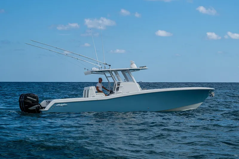  Yacht Photos Pics 2023 Invincible 36 Open Fisherman boat on open sea, clear sky background.