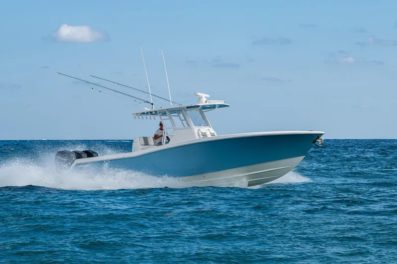  Yacht Photos Pics 2023 Invincible 36 Open Fisherman boat cruising on open sea.