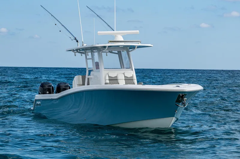  Yacht Photos Pics 2023 Invincible 36 Open Fisherman boat on open sea, featuring dual engines.