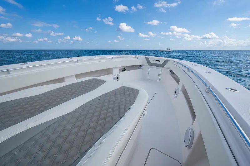  Yacht Photos Pics 2023 Invincible 36 Open Fisherman boat on open sea under blue sky.