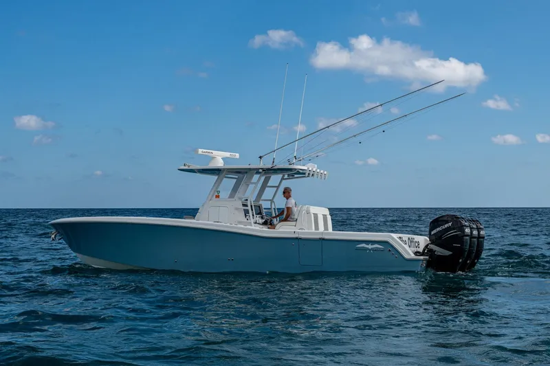  Yacht Photos Pics 2023 Invincible 36 Open Fisherman boat on open sea with clear blue sky.