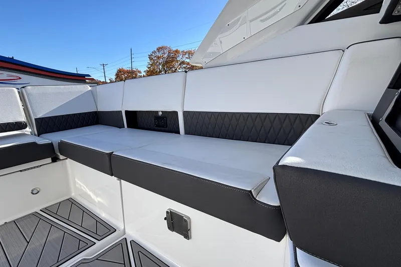  Yacht Photos Pics 2023 Monterey 385SS Super Sport boat interior with sleek white seating and modern design.