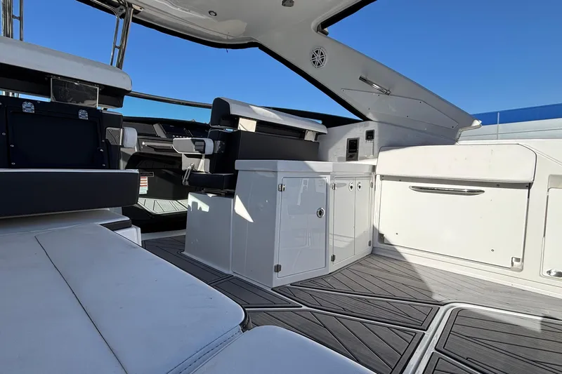  Yacht Photos Pics 2023 Monterey 385SS Super Sport boat interior with sleek seating and modern design.