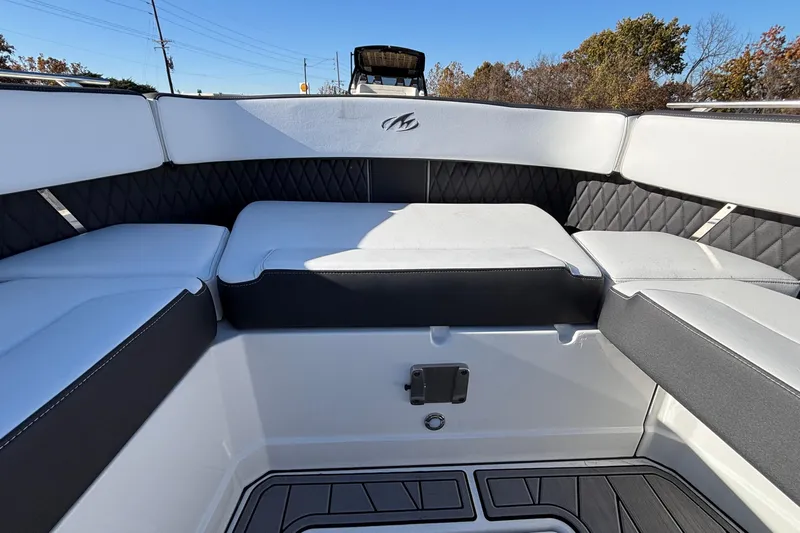  Yacht Photos Pics 2023 Monterey 385SS Super Sport boat interior with cushioned seating and sleek design.