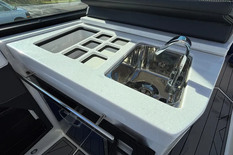 Yacht Photos Pics Luxury kitchenette on 2023 Monterey 385SS Super Sport boat with sink and storage.