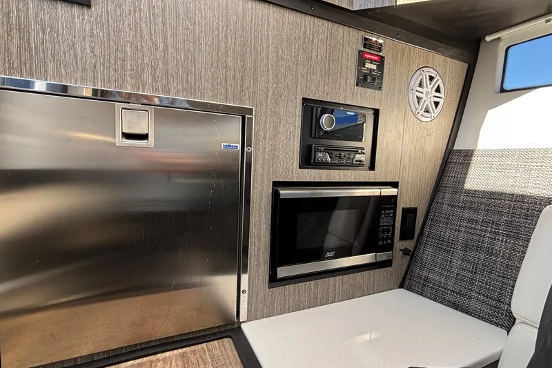  Yacht Photos Pics 2023 Monterey 385SS Super Sport interior with stainless appliances and modern audio system.