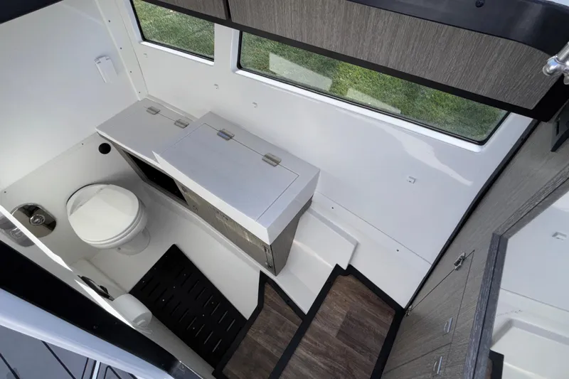  Yacht Photos Pics 2023 Monterey 385SS Super Sport boat interior bathroom with modern fixtures and wood accents.