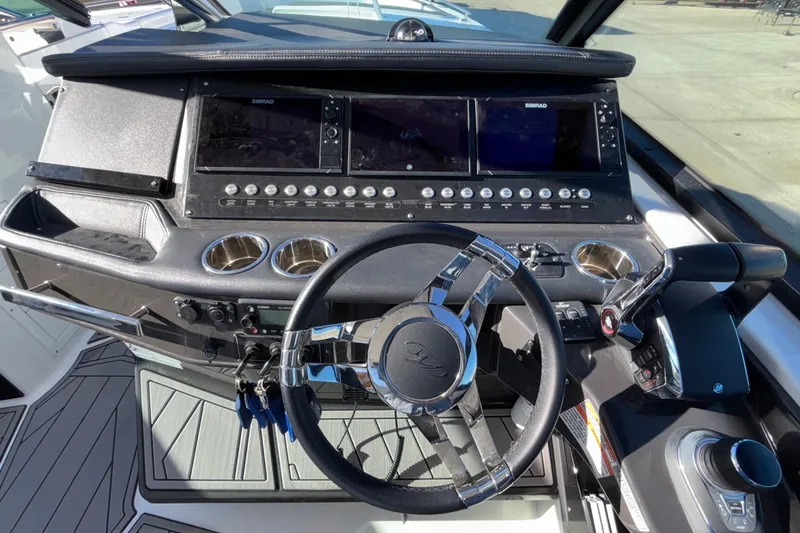  Yacht Photos Pics Cockpit of 2023 Monterey 385SS Super Sport boat with modern controls and steering wheel.
