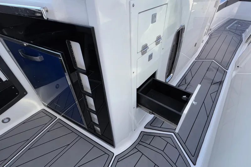  Yacht Photos Pics 2023 Monterey 385SS Super Sport boat interior with open storage drawer.