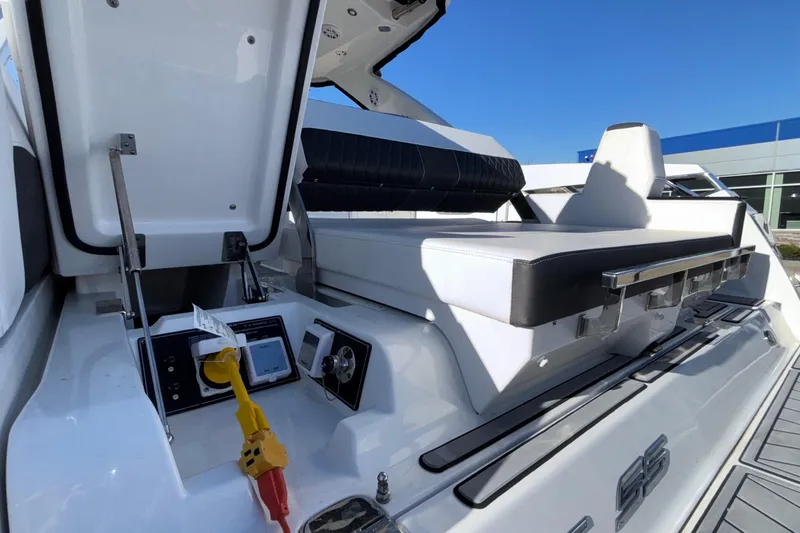  Yacht Photos Pics 2023 Monterey 385SS Super Sport boat interior with seating and control panel.