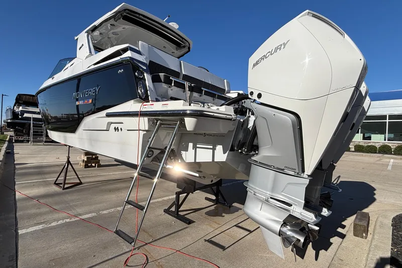  Yacht Photos Pics 2023 Monterey 385SS Super Sport boat with Mercury outboard engine on display.