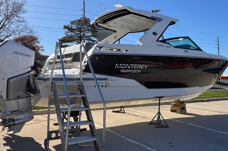  Yacht Photos Pics 2023 Monterey 385SS Super Sport boat with Mercury engine on display.
