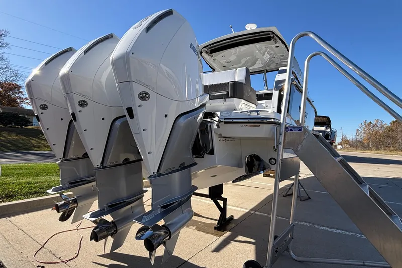  Yacht Photos Pics 2023 Monterey 385SS Super Sport boat with triple outboard engines on display.