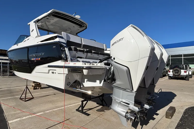  Yacht Photos Pics 2023 Monterey 385SS Super Sport boat with Mercury engines on display outdoors.
