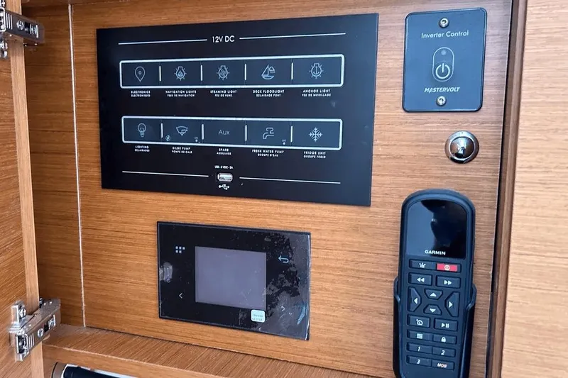  Yacht Photos Pics Control panel of 2024 Beneteau First 44 yacht with Garmin device and inverter control.