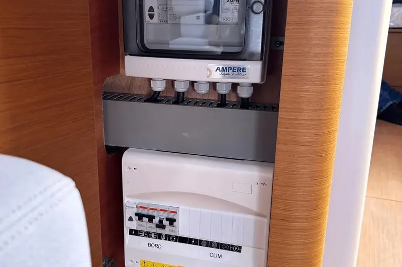  Yacht Photos Pics Electrical panel inside 2024 Beneteau First 44 yacht, featuring Ampere components.