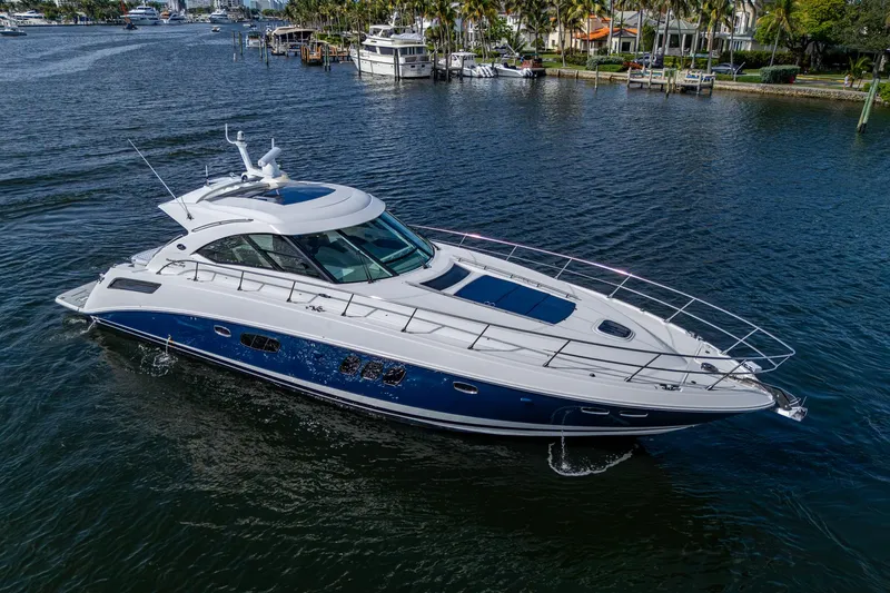 Sea N Starrs Yacht Photos Pics 2012 Sea Ray 540 Sundancer yacht cruising on a calm waterway.