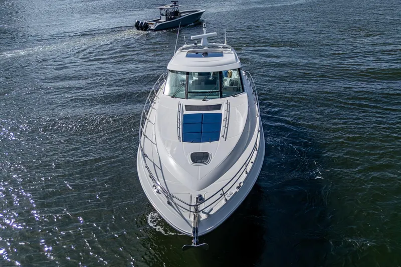 Sea N Starrs Yacht Photos Pics 2012 Sea Ray 540 Sundancer yacht cruising on open water, viewed from the front.