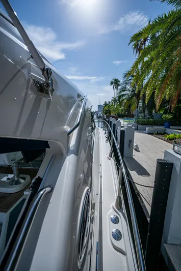 Sea N Starrs Yacht Photos Pics Side view of a 2012 Sea Ray 540 Sundancer yacht docked under a sunny sky.