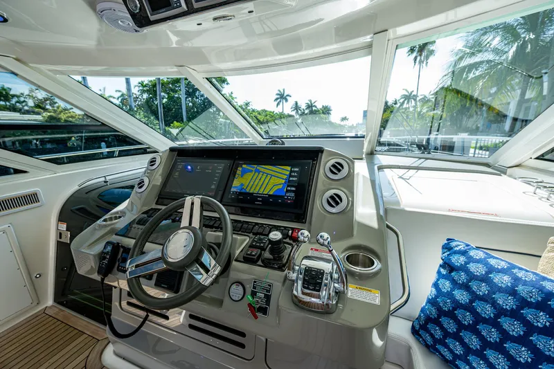 Sea N Starrs Yacht Photos Pics 2012 Sea Ray 540 Sundancer helm with modern navigation system and tropical view.