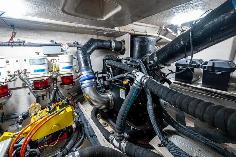 Sea N Starrs Yacht Photos Pics Engine room of 2012 Sea Ray 540 Sundancer with complex machinery and hoses.