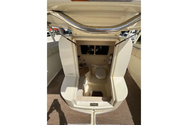  Yacht Photos Pics 2015 Chris-Craft Catalina 29 boat interior with open hatch and visible toilet.