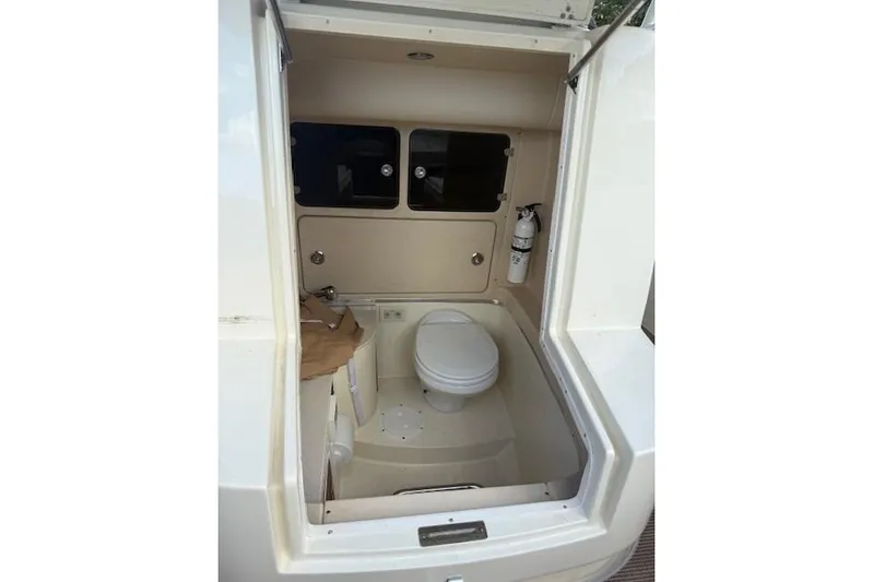 Yacht Photos Pics 2015 Chris-Craft Catalina 29 boat interior with toilet and storage compartments.