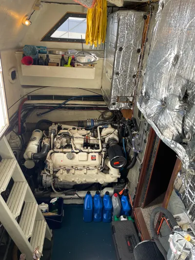 Safe N Sound Yacht Photos Pics 1988 Canoe Cove Tri Cabin engine room with equipment and supplies.