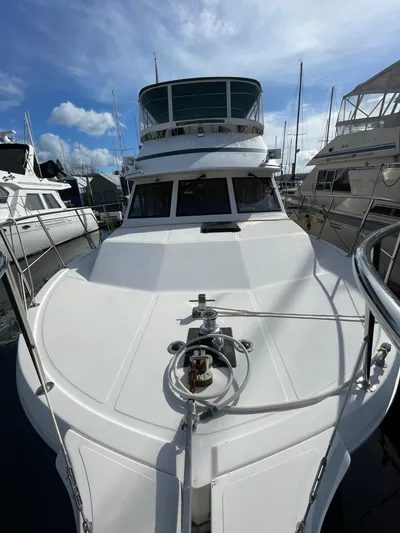Safe N Sound Yacht Photos Pics 1988 Canoe Cove Tri Cabin yacht docked at marina under blue sky.