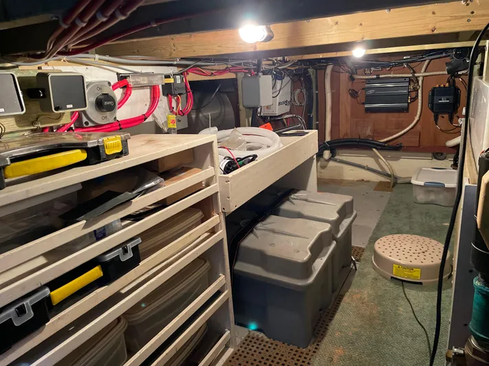 Safe N Sound Yacht Photos Pics 1988 Canoe Cove Tri Cabin engine room with organized storage and electrical systems.