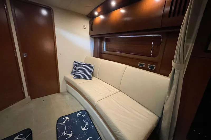  Yacht Photos Pics Luxurious interior of 2007 Sea Ray 38 Sundancer yacht with elegant seating and nautical decor.