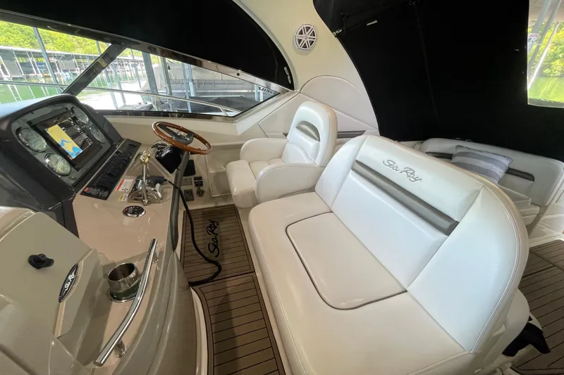  Yacht Photos Pics Interior of 2007 Sea Ray 38 Sundancer yacht with luxurious seating and navigation controls.