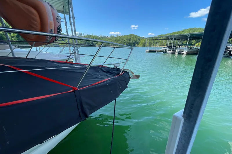  Yacht Photos Pics 2007 Sea Ray 38 Sundancer docked on a sunny day at a marina.