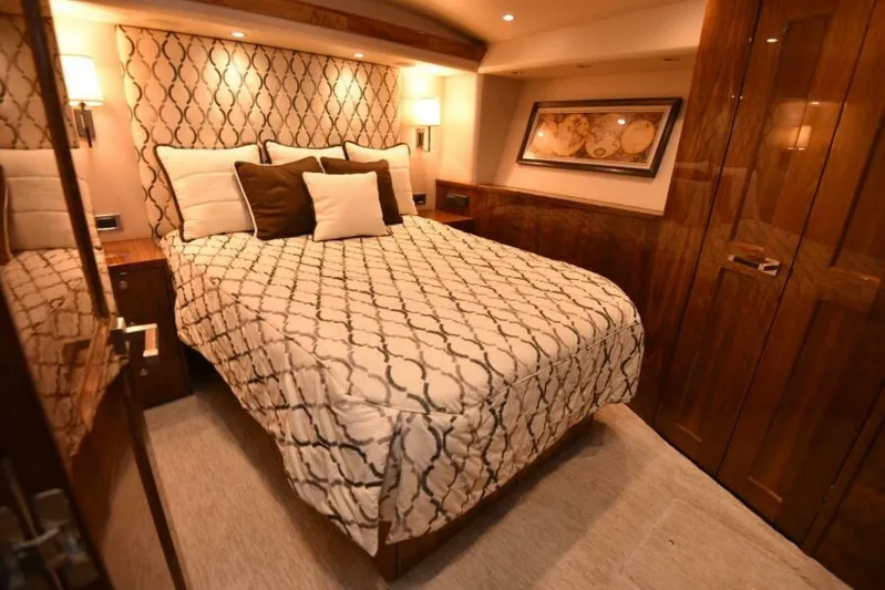 Another Day In Paradise Yacht Photos Pics Luxurious bedroom interior of 2017 Viking 80 Sky Bridge yacht with elegant decor.