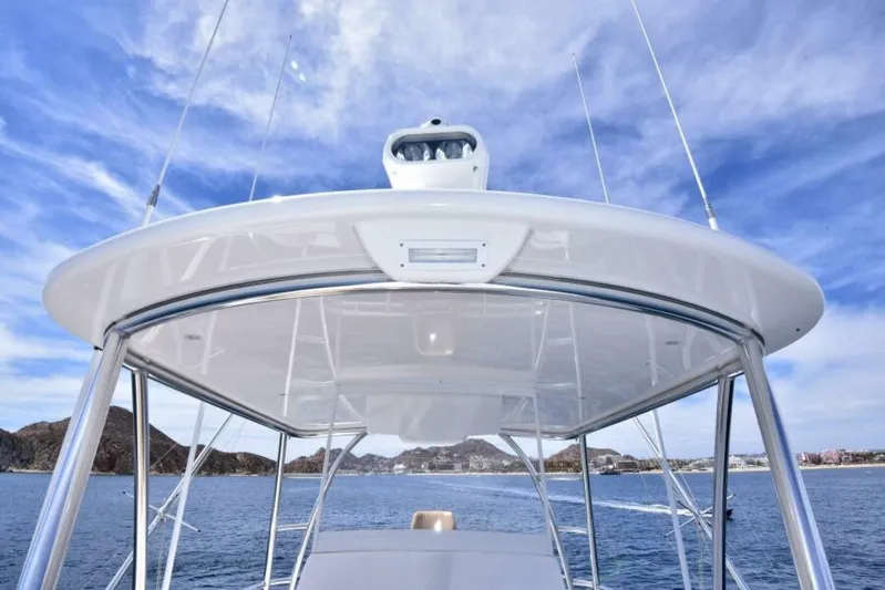 Another Day In Paradise Yacht Photos Pics 2017 Viking 80 Sky Bridge yacht with sleek design on open water.